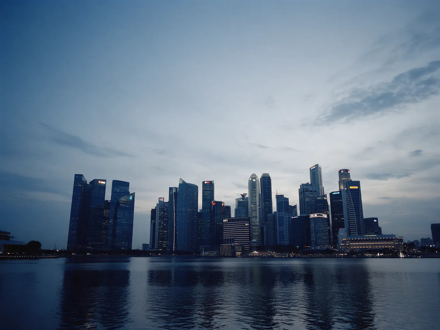 Singapore city skyline across the water at dusk