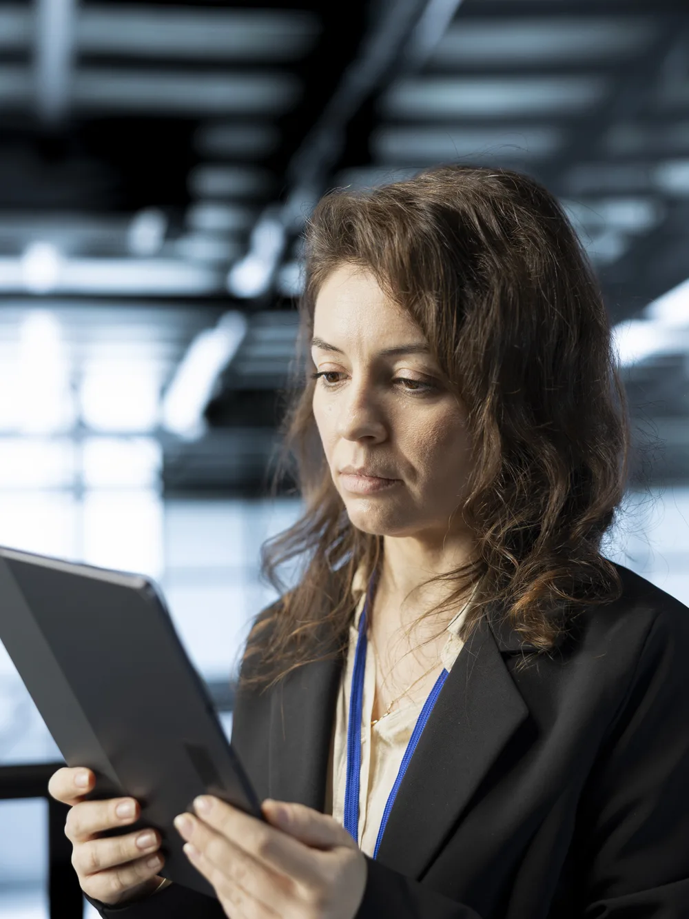 Technology lead checking delivery metrics on a tablet