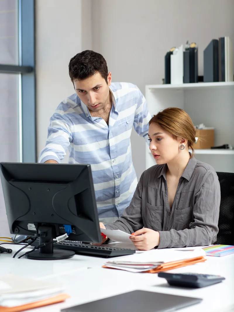 Quality engineer reviewing acceptance criteria with a product owner