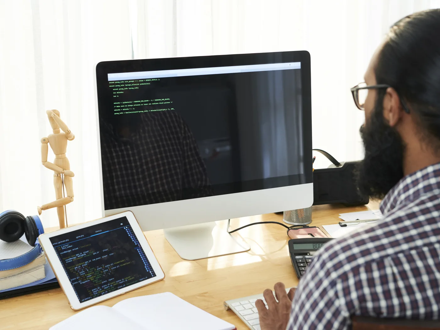 Engineer reviewing automation code on a desktop screen