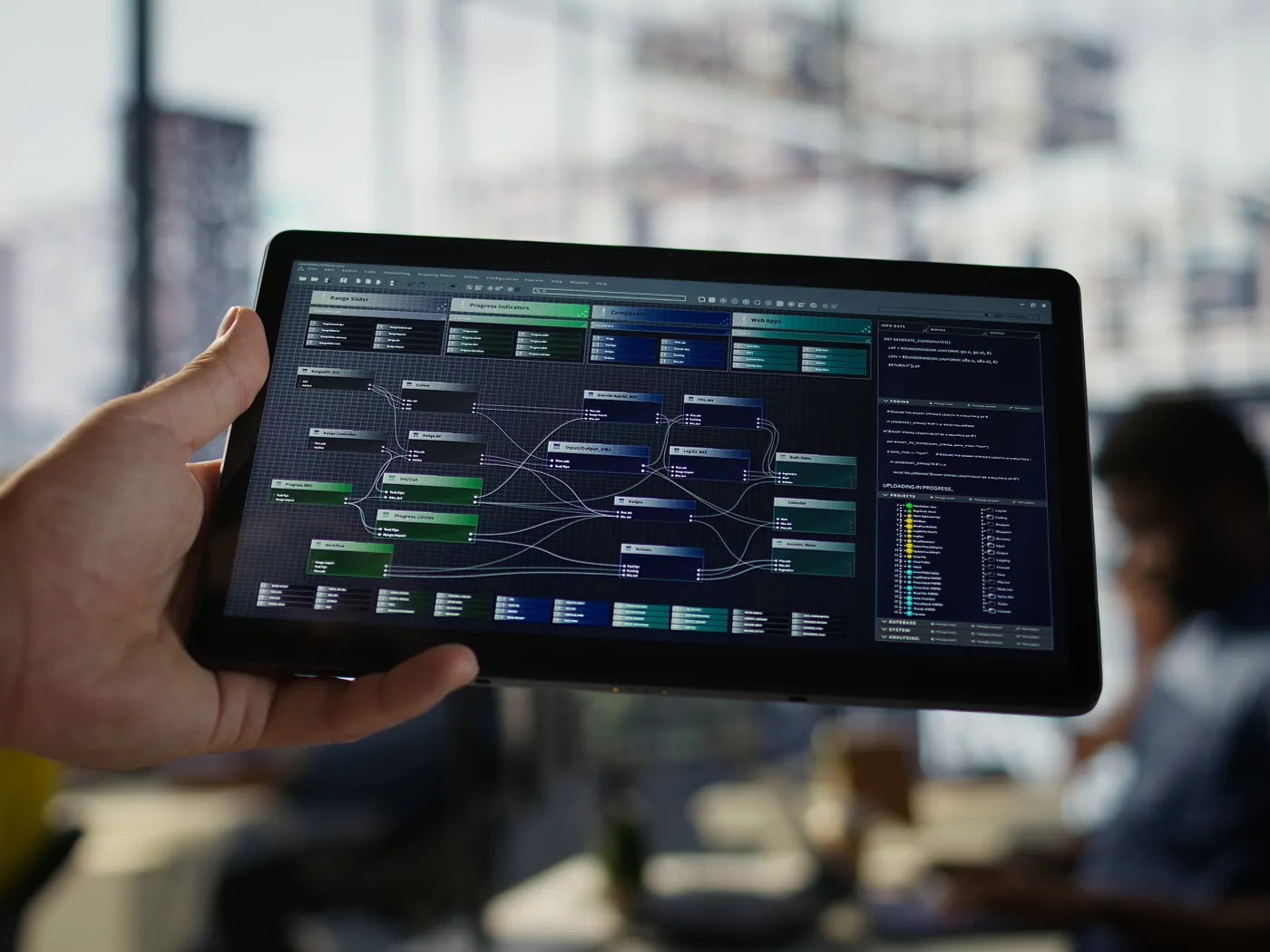 Hand holding tablet showing an automated process workflow
