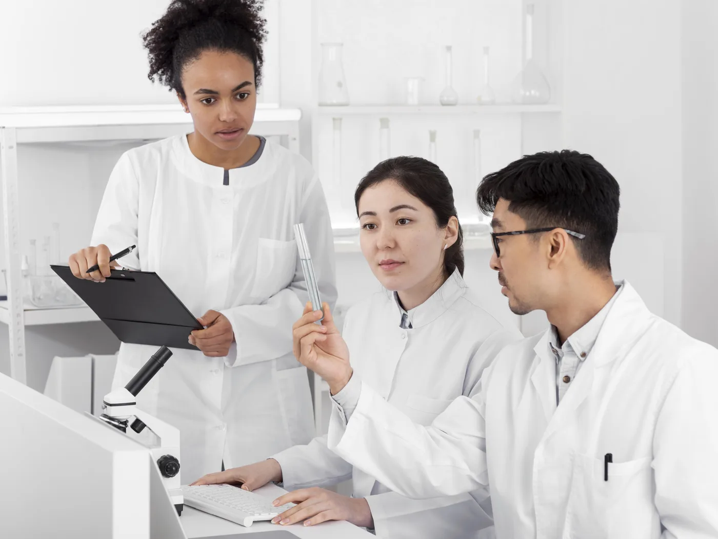 Researchers discussing work in a laboratory