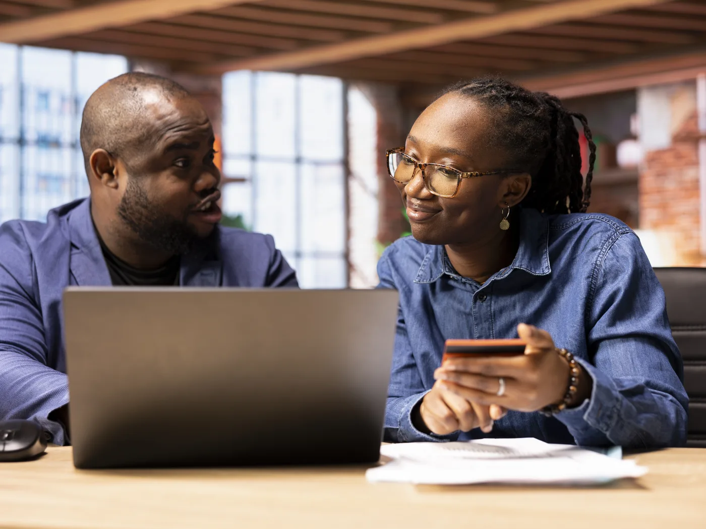 Couple making an online bank payment on laptop