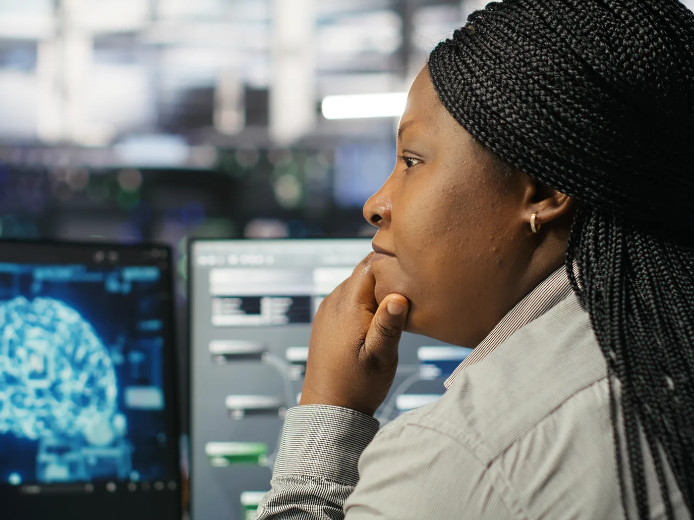 Engineer studying an AI model on screen