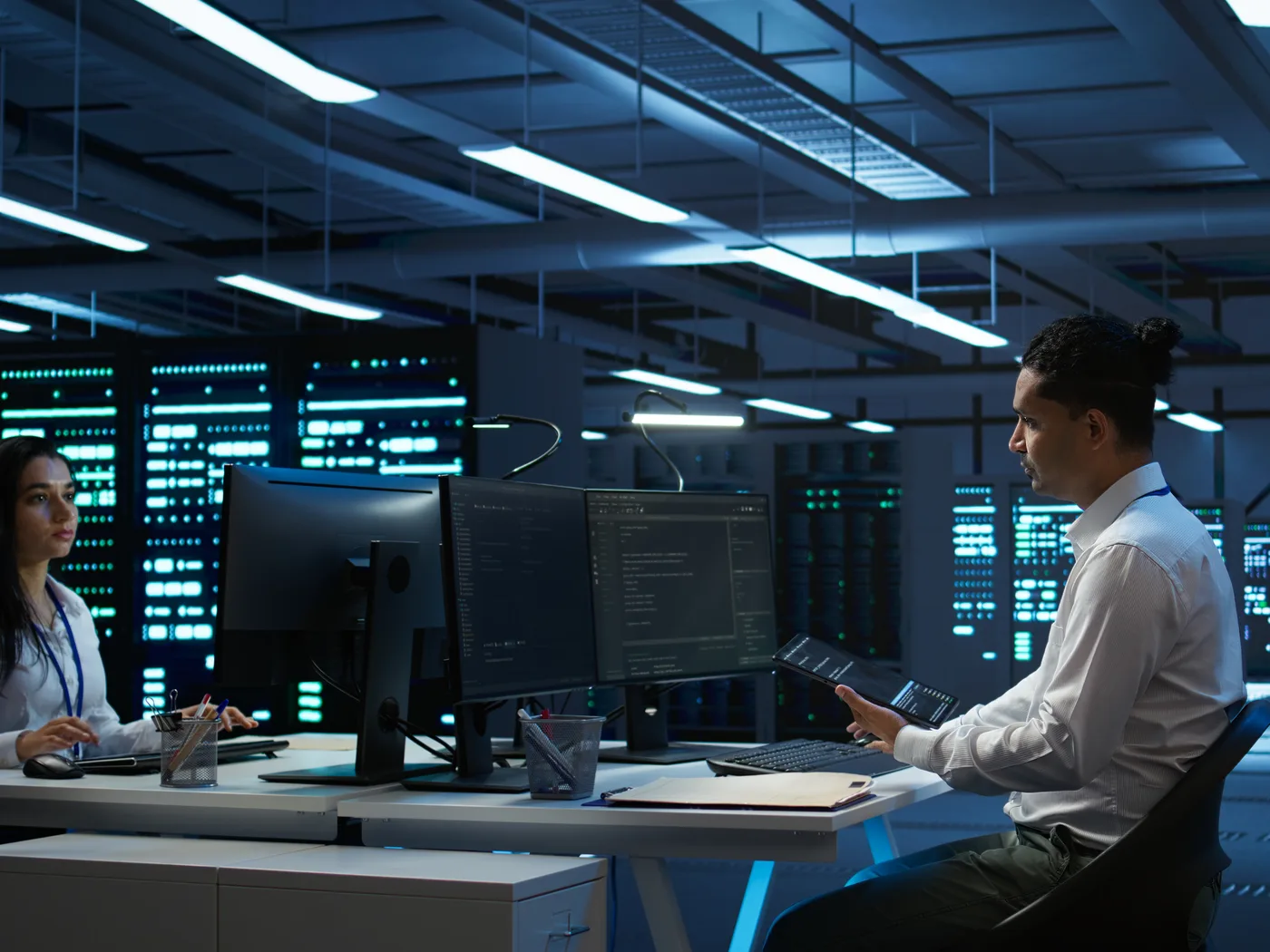 Engineers running performance checks in a data center