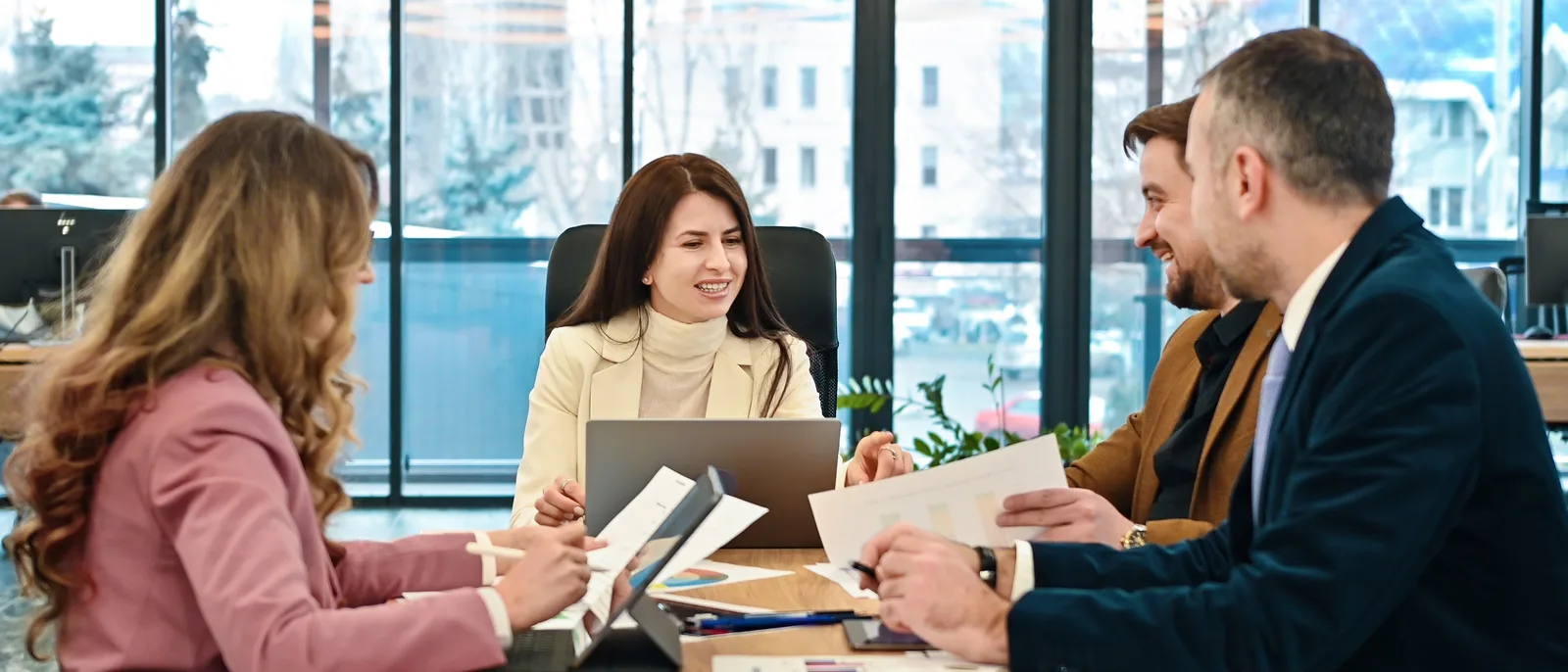Team meeting around a table in bright office
