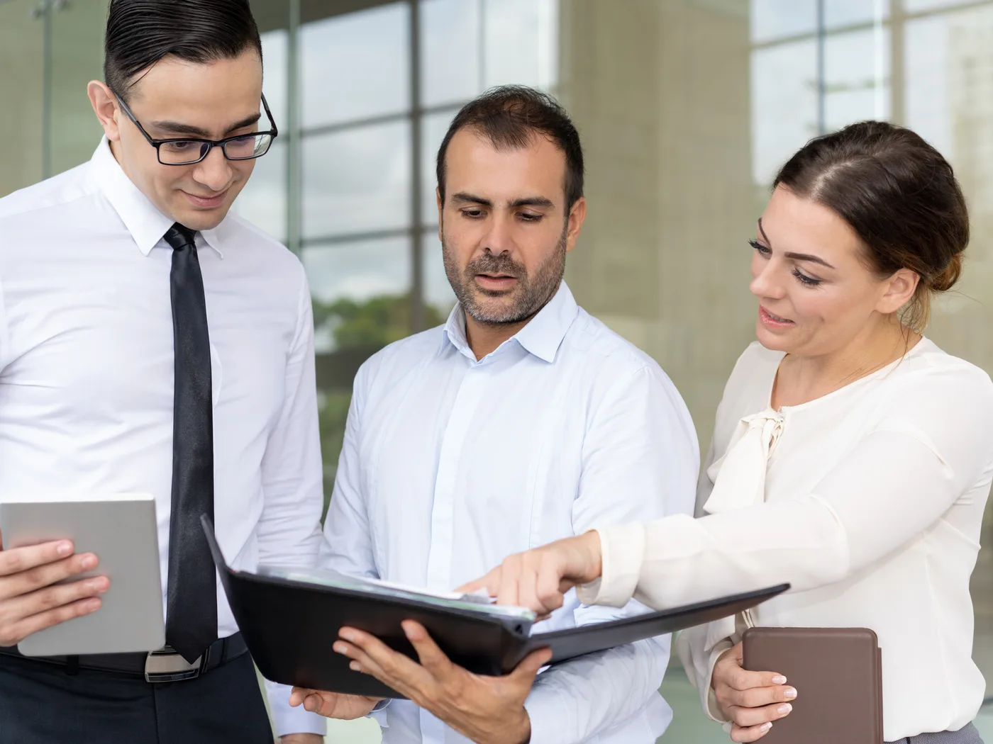 Consultants reviewing an assessment document together