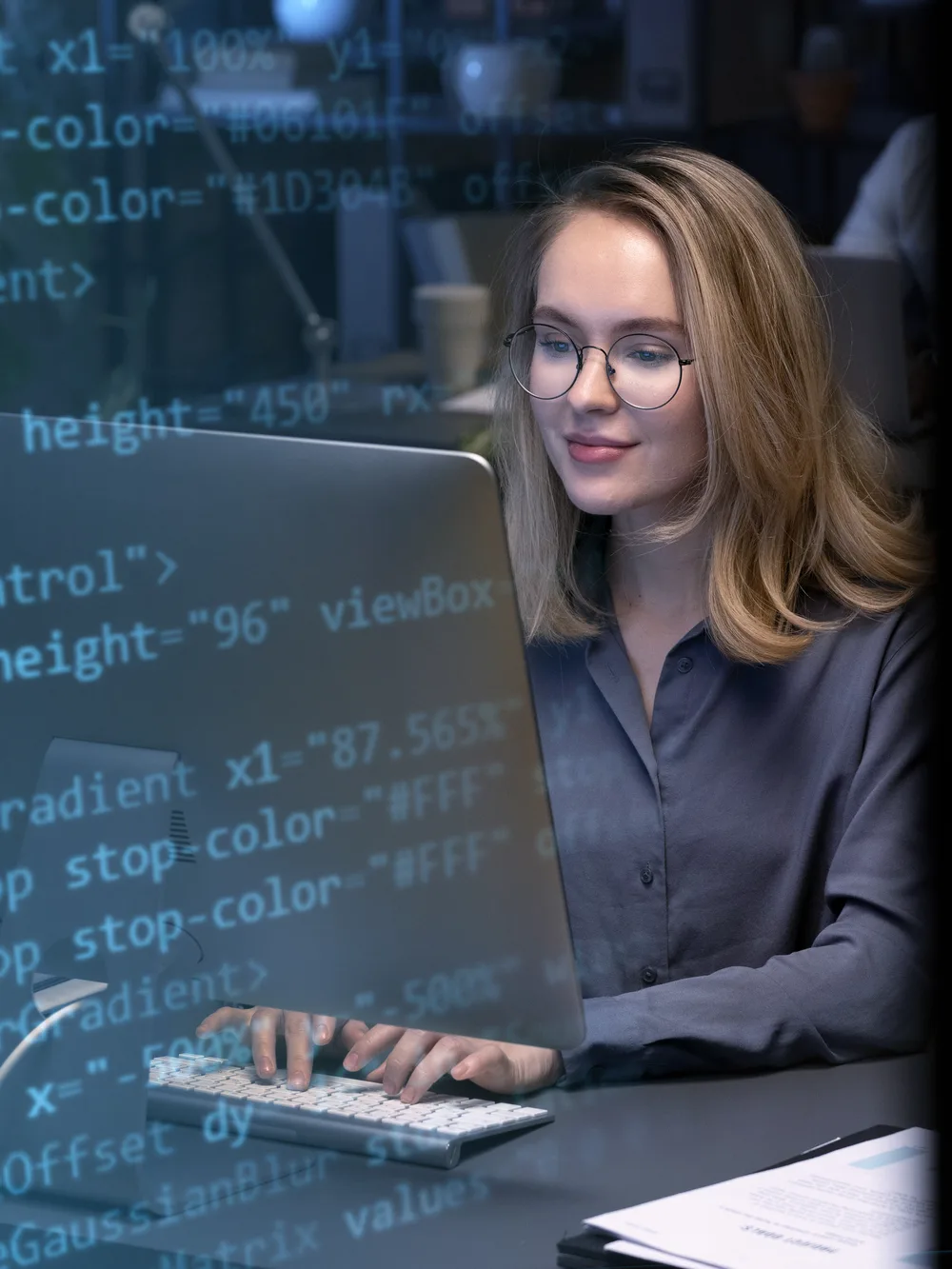 Engineer coding with test scripts on screen
