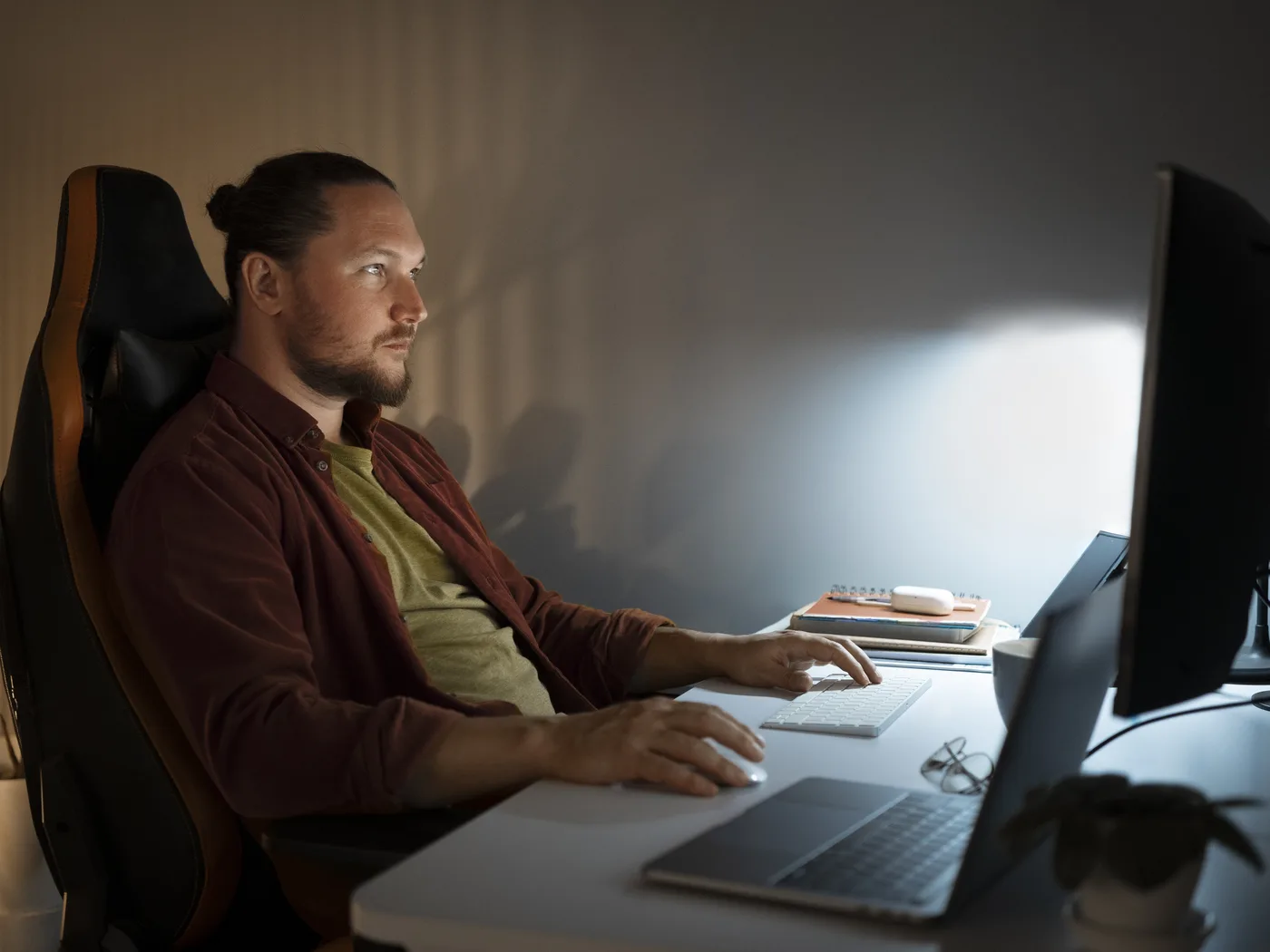 Man working at computer late at night
