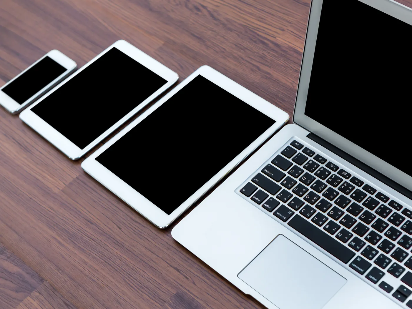 Phones, tablets and laptop lined up by size