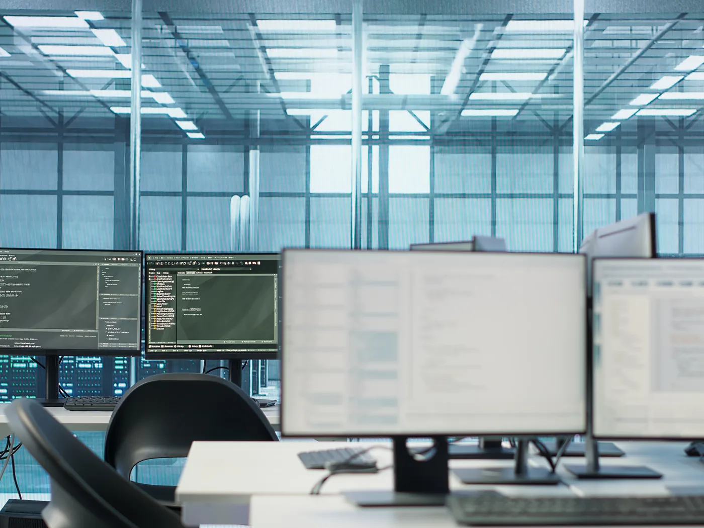 Row of monitors running scripts in a data centre