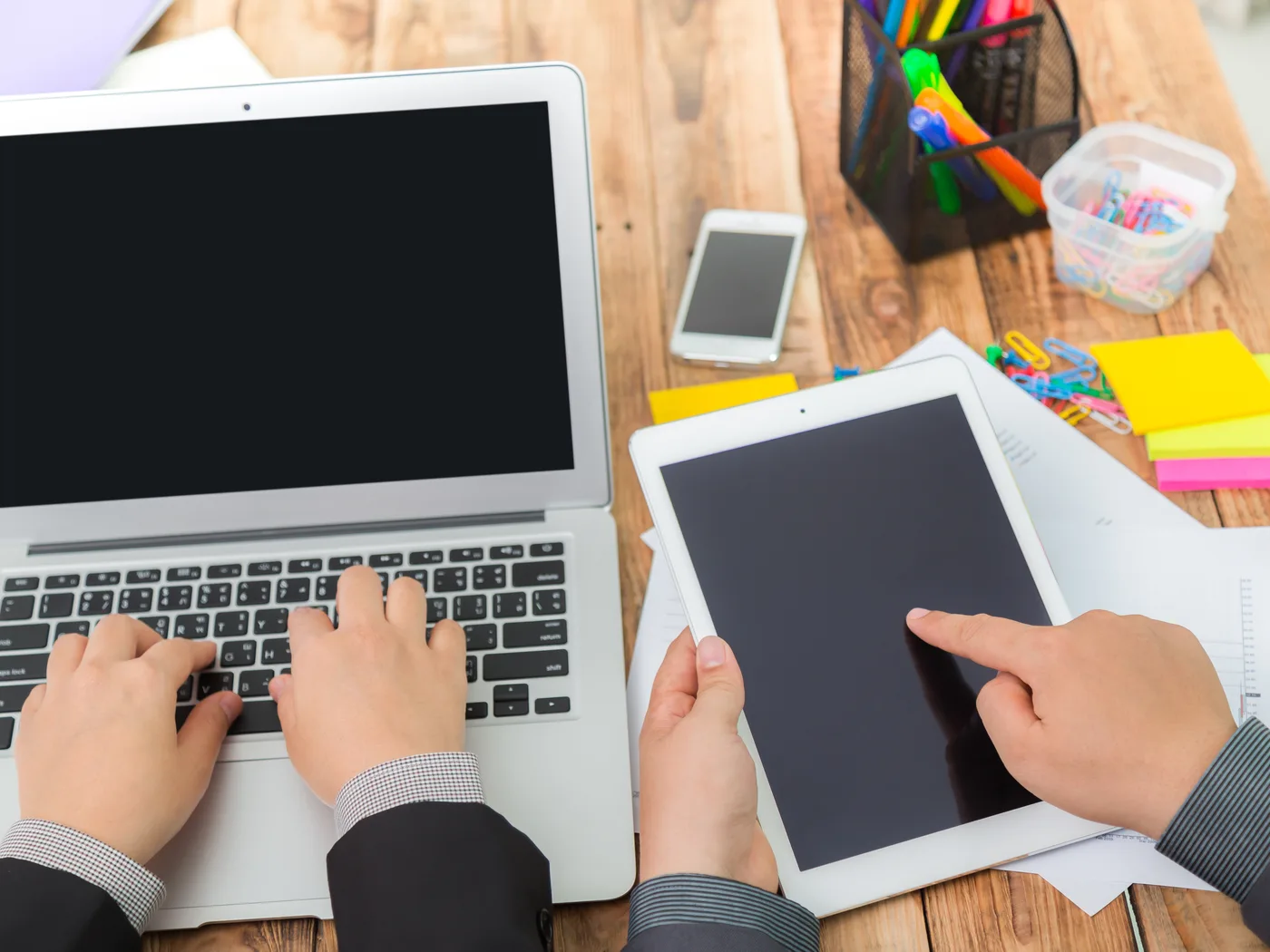 Laptop, tablet and smartphone used together on desk