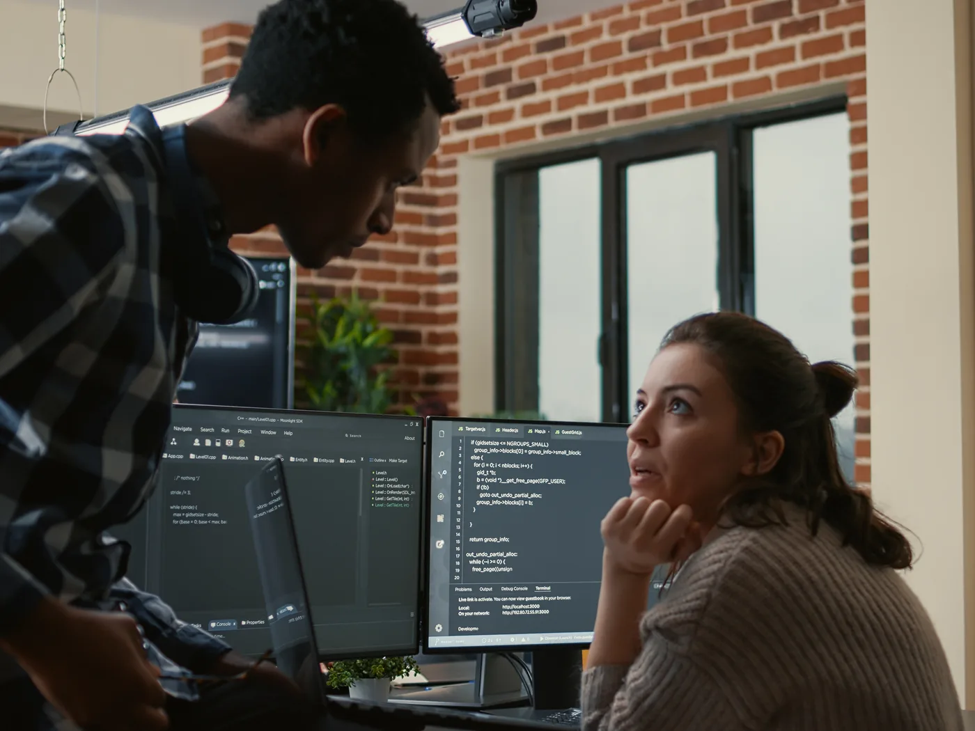Developer showing code to a colleague for fast feedback