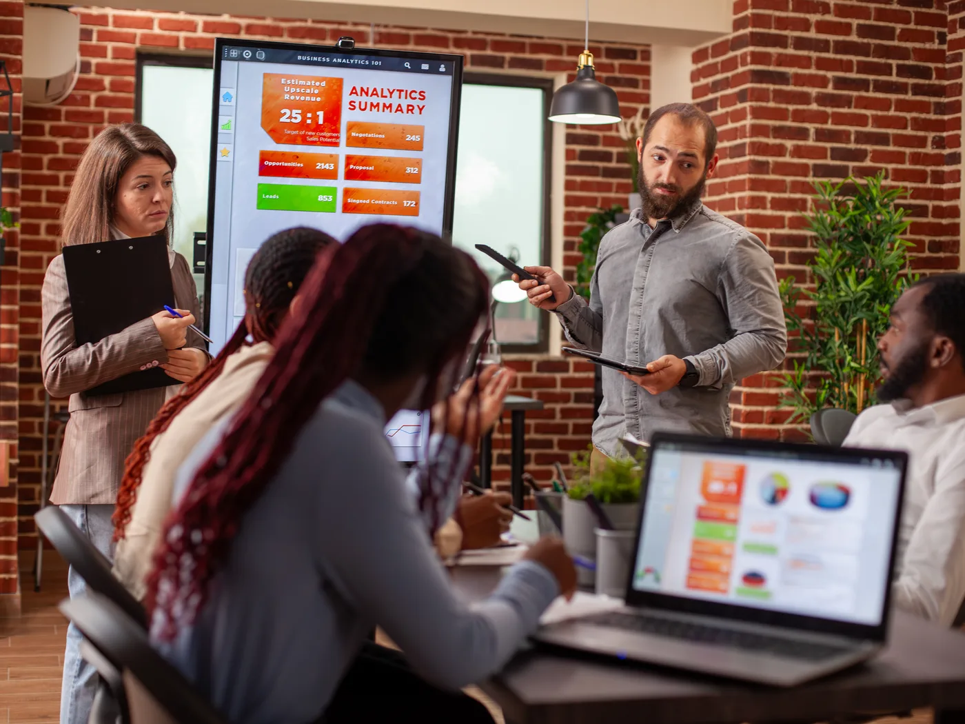 Team reviewing an environment status board