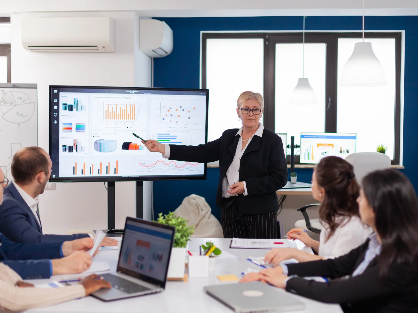Leader presenting release readiness to the team in a meeting room